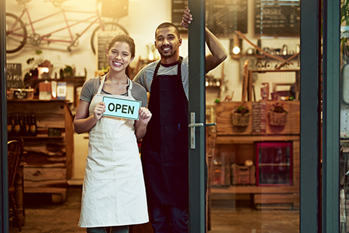Rearview shot of a male farmer and his two young kids on their farm.